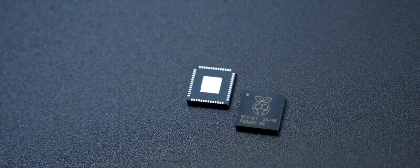 a couple of microchips sitting on top of a table