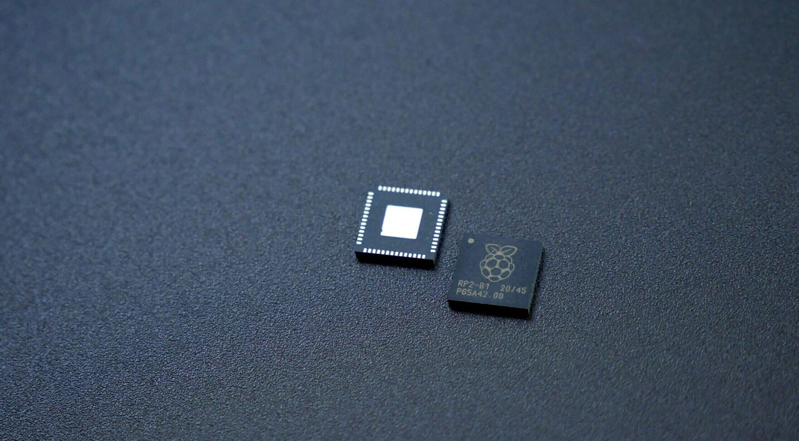 a couple of microchips sitting on top of a table